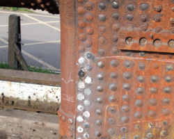 Work on grinding down and drilling out rivets has already begun by the boiler shop volunteers.