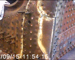In the boiler shop, similar work but on a larger scale continues. The is the right hand rear corner of the firebox, with stays having been drilled through on both the backplate and firebox lower side sheet.