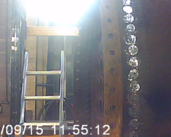 At the other end of the boiler, rivets securing the front tube plate get the drilling out treatment.