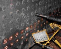 A view of the inside of the firebox showing where some of the copper stays on the left hand side have been drilled out prior to removal.