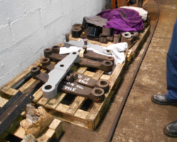 Two of the brake hangers cleaned and primer painted and the others awaiting the same treatment before being re-bushed.