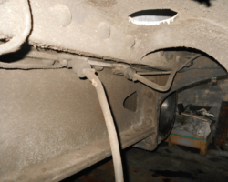 The underside of the front of the loco where the pony truck is fitted showing some of the oil pipes that need removal so that cleaning can take place before the area can be painted.