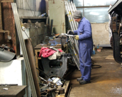 One of the Fund’s working party happy in his work!