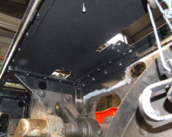 Various parts of the underside of the running plate, finish painted in gloss black.