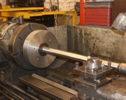 One of the Piston rods being machined in the machine shop.