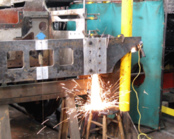 Grinding of the new rear buffer beam is in progress.