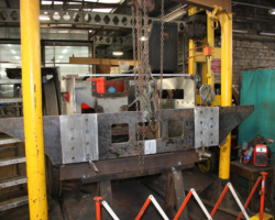 The replacement rear buffer beam lifted into place by a chain hoist ready for drilling through into the inner two of the four angles which join it to the main frames.