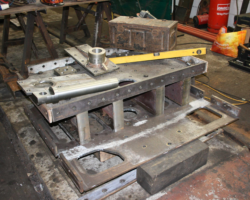 The new drag box after being taken out of the rear frames. Note the newly machined main draw pin laid on top of the drag box along with other parts of the drag box.