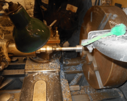 One of the afore mentioned new bolts being screwcut on one of the workshop’s lathes.