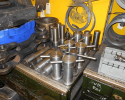 Newly machined pins of various sizes for the valve gear.