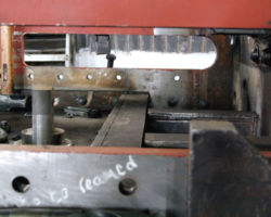 The message says, “To be reamed,” making the holes the exact size to take the rivets.