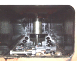 Looking between the upper and lower dragbox horizontal plates and with the drawbar pin prominent. Notice that the painters have already applied undercoat to this very inaccessible location.