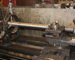 Finally a visit to the machine shop found new valve spindles being roughed out by the paid staff on one of the lathes.