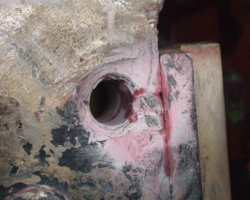 The area between the holes was repaired in 2012, so only the cracks beyond the two holes remain. These though extend the full thickness of the frame plate.