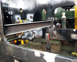 Looking through the right hand horn gap and showing braces fitted either side of the section to be removed, to ensure no movement or misalignment of the assembly as the new section is welded in.