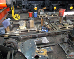 Other parts removed, the coupled axleboxes have been out for some town, while the old frame section occupies the foreground.