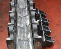 Beside them are four spring hangar brackets awaiting attention.