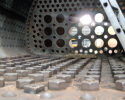 The top of the inner firebox, fire side, at the bottom of the photo. Note the rows of roof stays and their associated nuts.