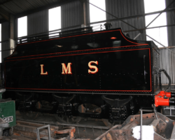 Meanwhile the tender has been ejected from the paint shop (to allow GWR coach 829 in for painting) and is now still under cover in the shed in all it’s glory LMS sporting the early LMS livery.