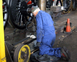 More parts painting: another Fund member tackles one of the cab doors.