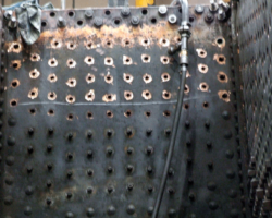 Inside the firebox, the stay holes for this section have been cleaned and await the stays’ fitment.