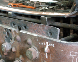At the rear of the firebox, edges have been ground clean in preparation for welding on the new lower backplate and work by copper welding is advanced on the rear of the crown sheet.