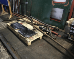 A selection of steam heat and vacuum brake pipework awaitng cleaning up keeps part of the newly painted Left hand running plate company.