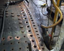 The rear of the inner copper side sheet, giving a clear impression of how the groove has been ground out prior to being built up by copper welding.