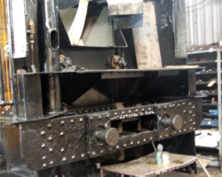 The front of the tender, with the handbrake stanchion complete, intermediate buffers in place and the water valves fitted and coupled up.