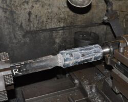 Tender brake adjuster rod in the lathe, after welding before turning.