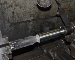 Tender brake adjuster rod in the lathe, after turning, ready for thread cutting.