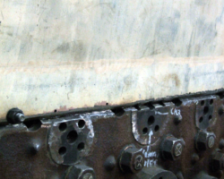 The joint across the rear of the firebox. The nuts and bolts attach the new section to a supplementary plate inside the actual backplate, so holding it firmly in place. Note that both plates have been ‘vee’d’ to allow maximum penetration of the steels’ thickness during welding.