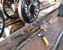 So a hydraulic jack was used to force the wheel across to the other side.