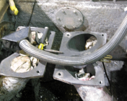 Inside the smokebox saddle some wasted steel is being built up by welding.