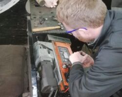 Drilling holes in the new running plate for fitting.