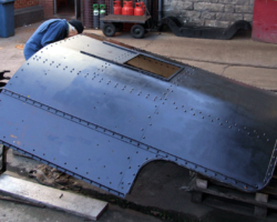 The first coat finished; a second will be applied before attention turns the inside faces.