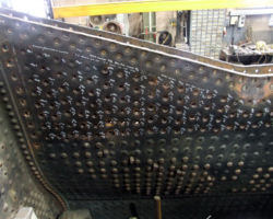 Further forward, the lower side sheet stay holes are sized and marked up for the new stays.