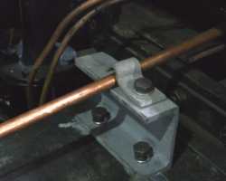 The pipe for the right hand back sander crosses the footplate below floor level and has a second bracket, seen here completed.