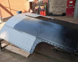 The first coat of undercoat on part of the cab roof.