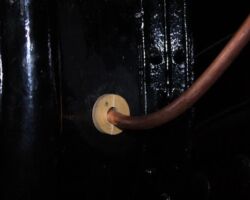 Finally a small but necessary item (also made and fitted by our expert woodworker). This steam pipe to the Right hand trailing sander passes through a hole in the lower front of the cab and to prevent rubbing or chafing this wooden “washer” was created.