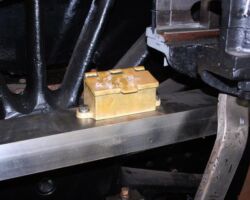 The oil box for the Right hand upper slide bar in firmly bolted down.