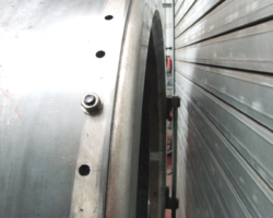 Viewed from the side, with holes drilled and attached by nuts and bolts prior to riveting.