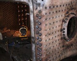 Meanwhile in the boiler shop we found that the foundation ring had been largely riveted in place in the back.