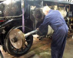 With the piston hanging from the forks, the rear of the rod was inserted into the cylinder.