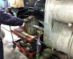 The piston head was then lowered on to a rising wheeled trolley . . .