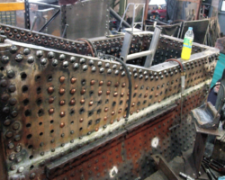 In the boiler shop, more stays have been installed but on the day, SVR staff Phil and Jack were fitting the rivets to the right side front corner of the foundation ring. It’s thirsty work, riveting . . .