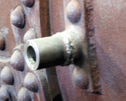Welding on the collars for the handrail and ejector exhaust pipe mountings continues.