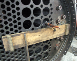 To the right, the main steam pipe emerges behind the timber packing compressing it against the rear section...