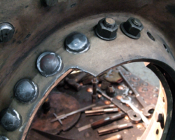 Work has started to trim the excess metal around the firehole door.