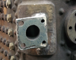 This is the repaired mounting flange for the manifold mounting, the face finish welded, the stud holes drilled and tapped.